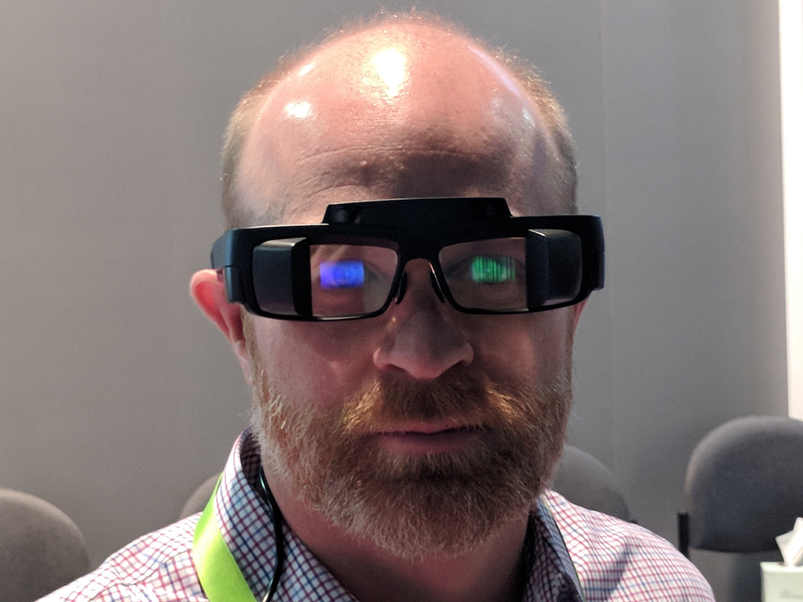 A man wearing augmented reality glasses with transparent displays