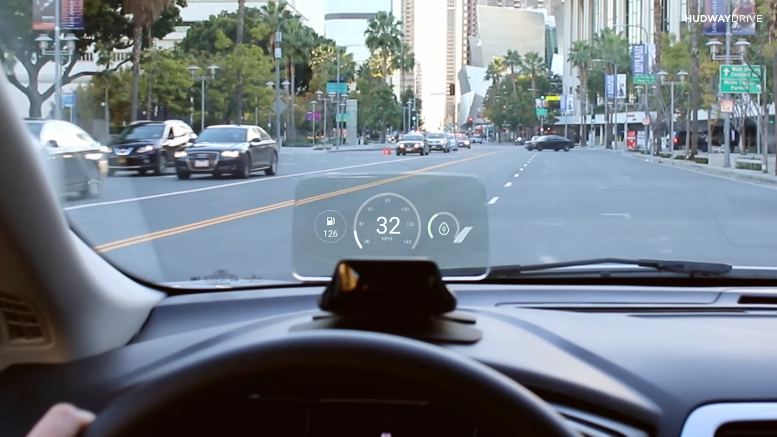A head-up display for speed and fuel, mounted to a car dashboard